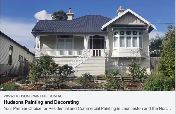 Historic home with fresh paint and landscaping.