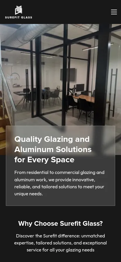 Modern office with glass partitions and tables