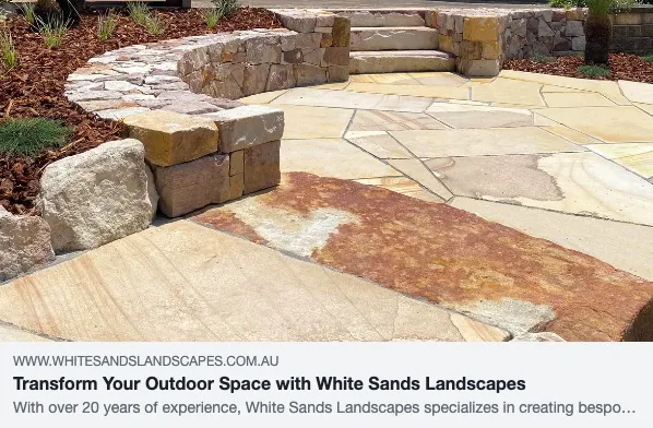 Stone patio and steps with landscaped garden.