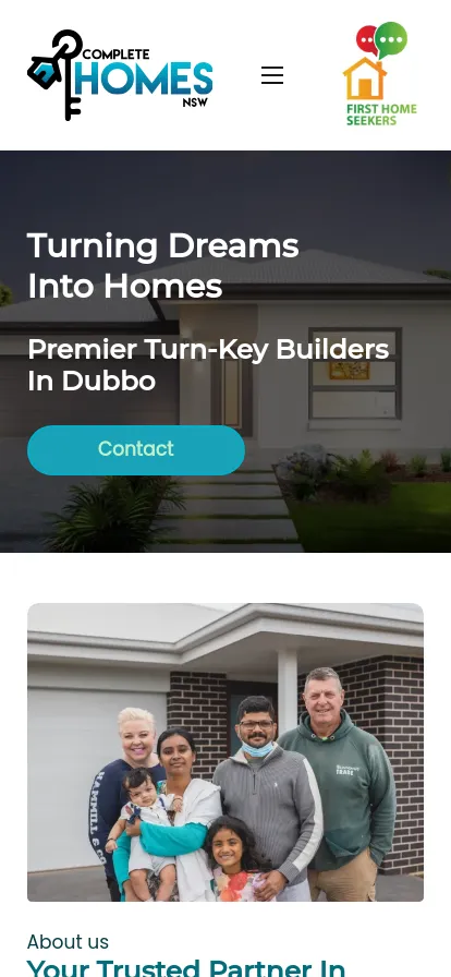 Family standing outside their new home.