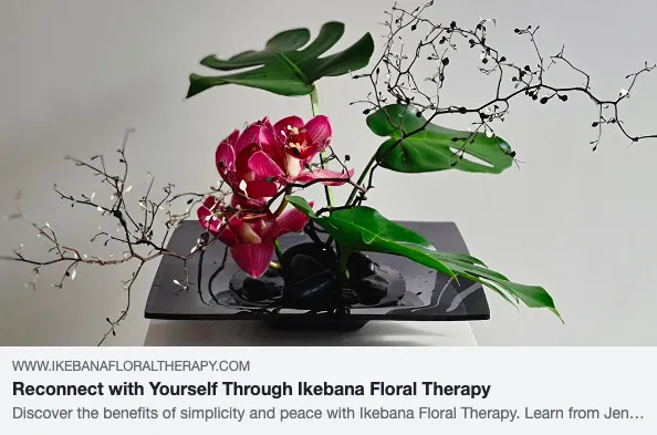 Ikebana floral arrangement with leaves and flowers