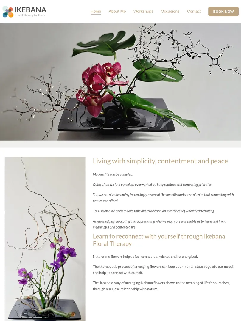 Ikebana floral arrangement with pink blossoms.