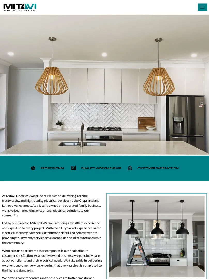 Modern kitchen with pendant lights and appliances.
