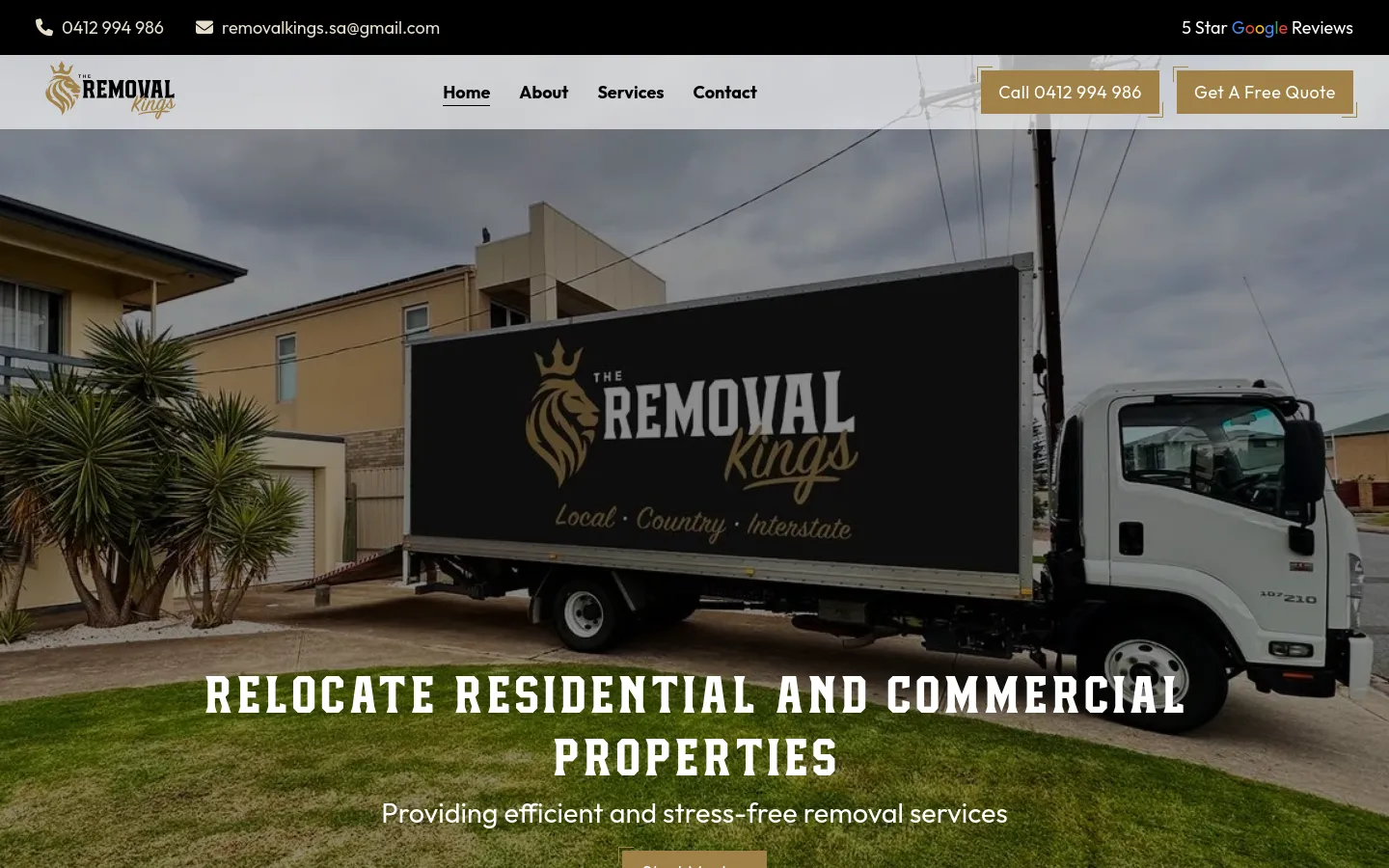 Removal truck parked in front of a house.